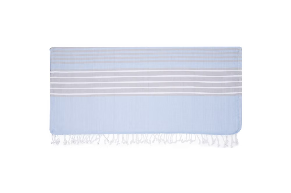 Mare Beach Towel-Light blue towel with white stripes and fringes on a white background
