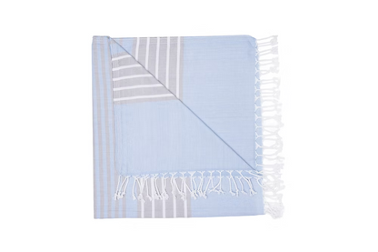 Mare Beach Towel-Light blue towel with white stripes and fringes on a white background