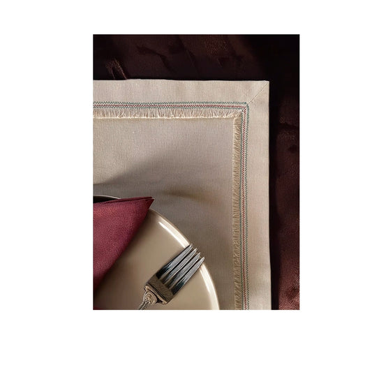 Nappina Placemat Set of 4-Beige napkin with a decorative edge on a white background