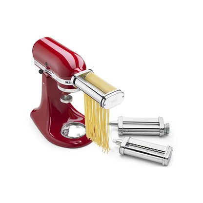 Red pasta maker with silver attachments on a white background