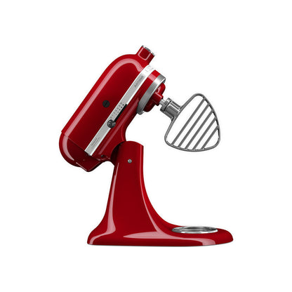 Red stand mixer with a flat beater attachment on a white background