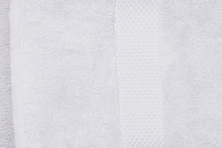 Sardegna Towel Set-Close-up of a textured white fabric with horizontal stripes