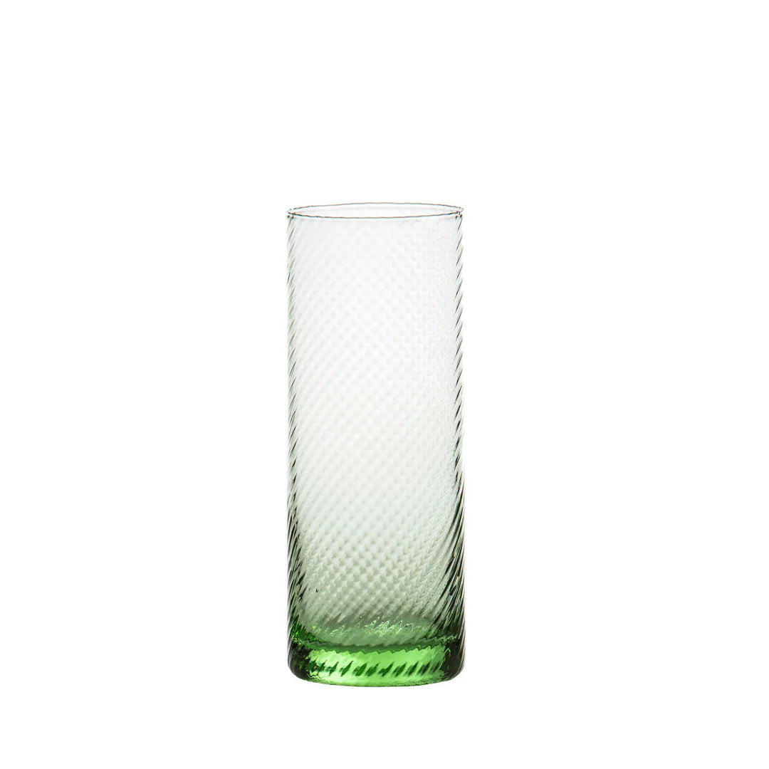 Green glass with textured design on a white background