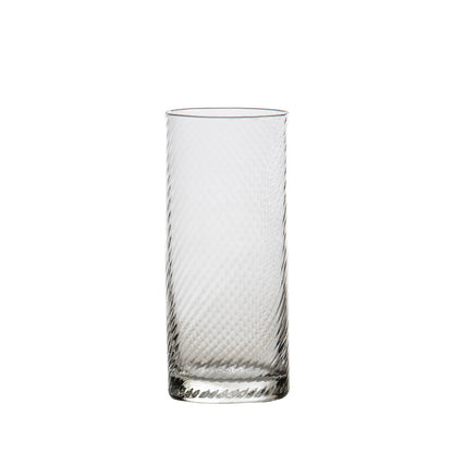 Clear glass with textured design on a white background