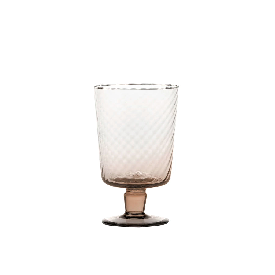 Clear glass with textured design on a white background
