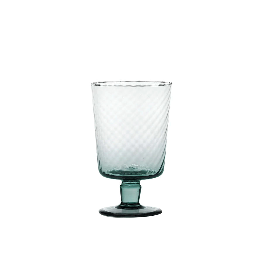 Clear glass with textured design on a white background