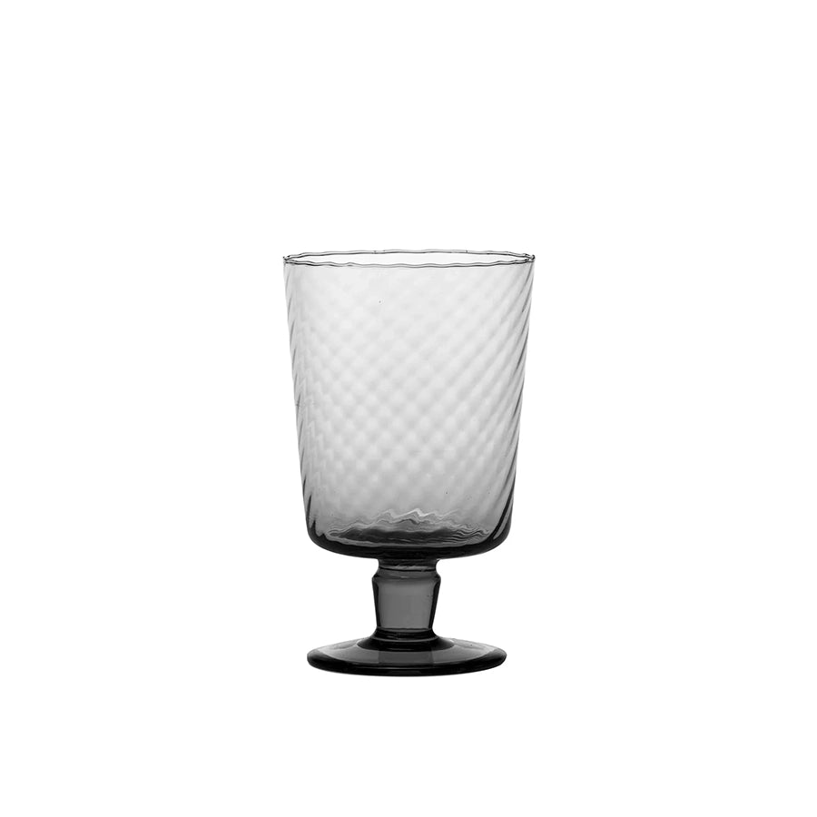 Clear glass with textured design on a white background