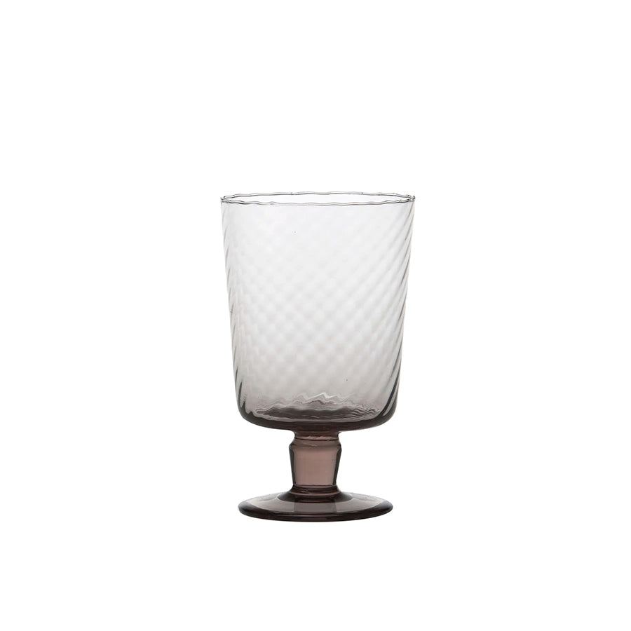 Clear glass with textured design on a white background