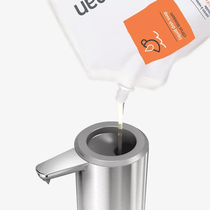 Simplehuman Liquid Dish Soap Uedu product being poured into a metallic container 