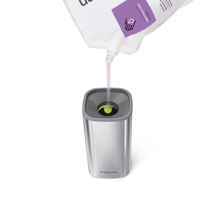 Simplehuman Pulse Pump Hand sanitizer being poured into a silver container 