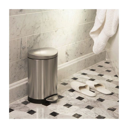 Simplehuman Semi Round Bin, 6 L-Silver trash can in a bathroom with tiled floor and towel.