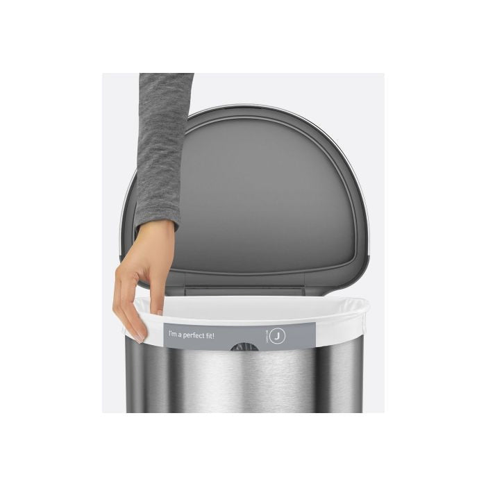Simplehuman Semi Round Sensor Bin With Liner Pocket-Gray trash can with a lid being held by a hand, displayed against a white background.