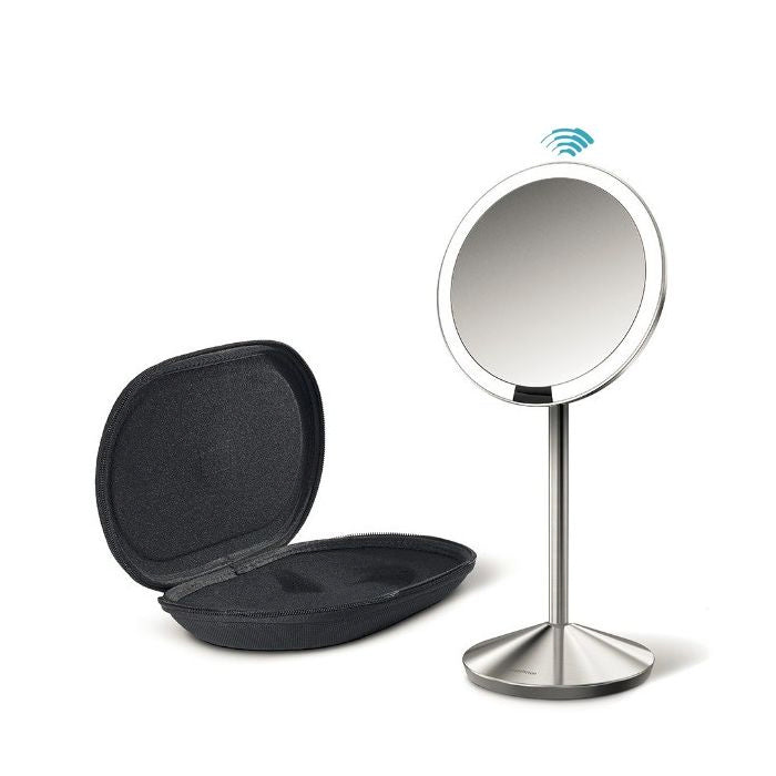 Simplehuman Sensor Mirror Fold with Travel Case-Stand-up makeup mirror with wireless charging pad on a white background