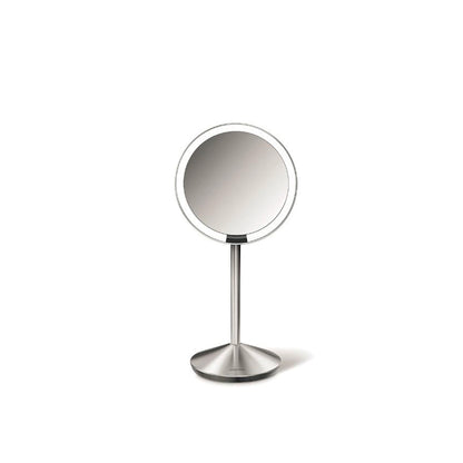 Simplehuman Sensor Mirror Fold with Travel Case-Round makeup mirror on a stand with a white background