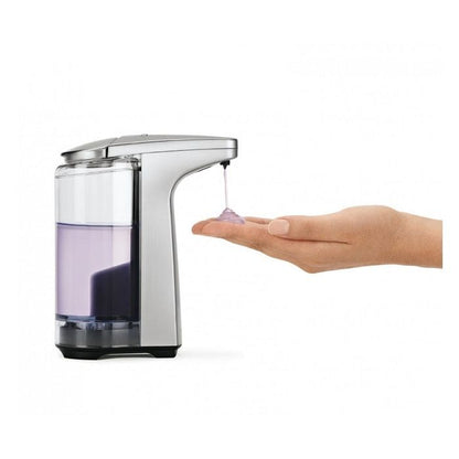 Simplehuman Sensor Pump with Soap-Hand pressing a soap dispenser with a clear liquid inside on a white background