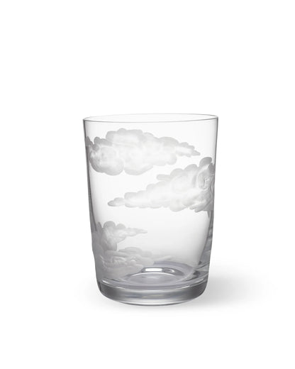 A clear glass tumbler with hand-engraved cloud designs.