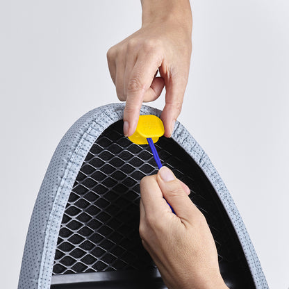 UAE laundry room-Person using a tool to open a pet carrier with a white background