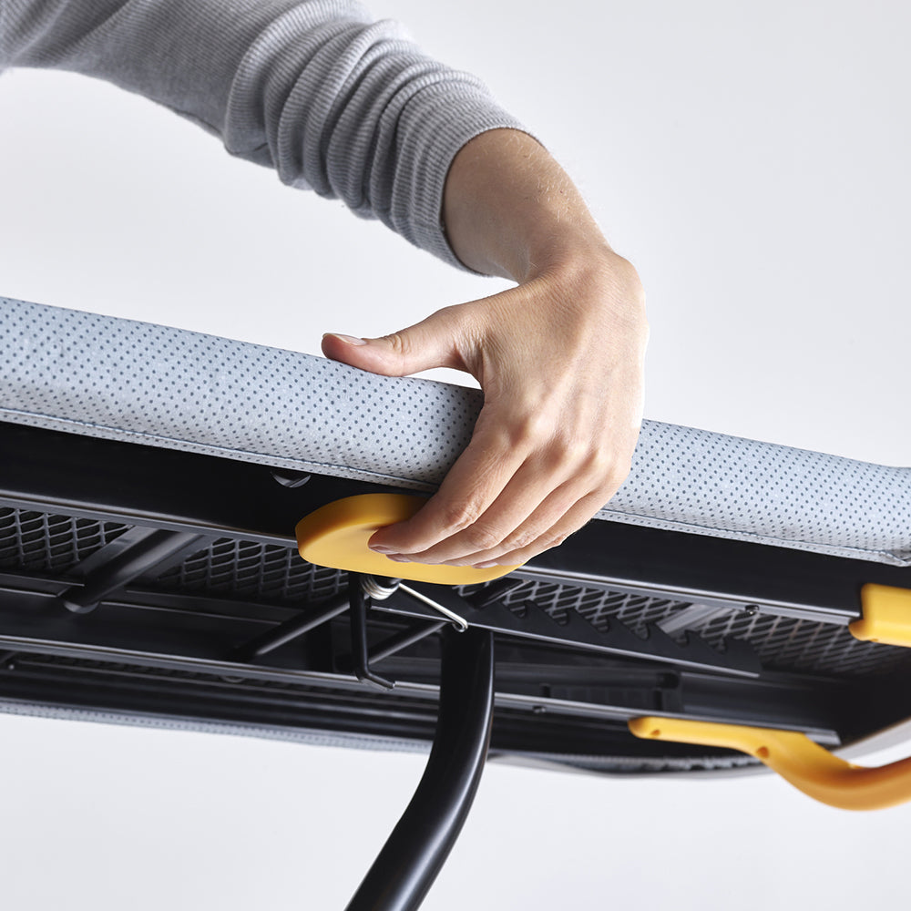UAE laundry room-Person adjusting a car's sunshade with a hand on a white background