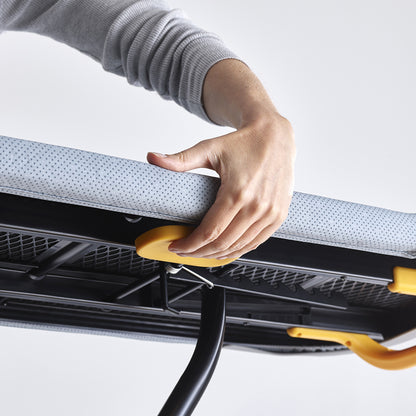 UAE laundry room-Person adjusting a car's sunshade with a hand on a white background