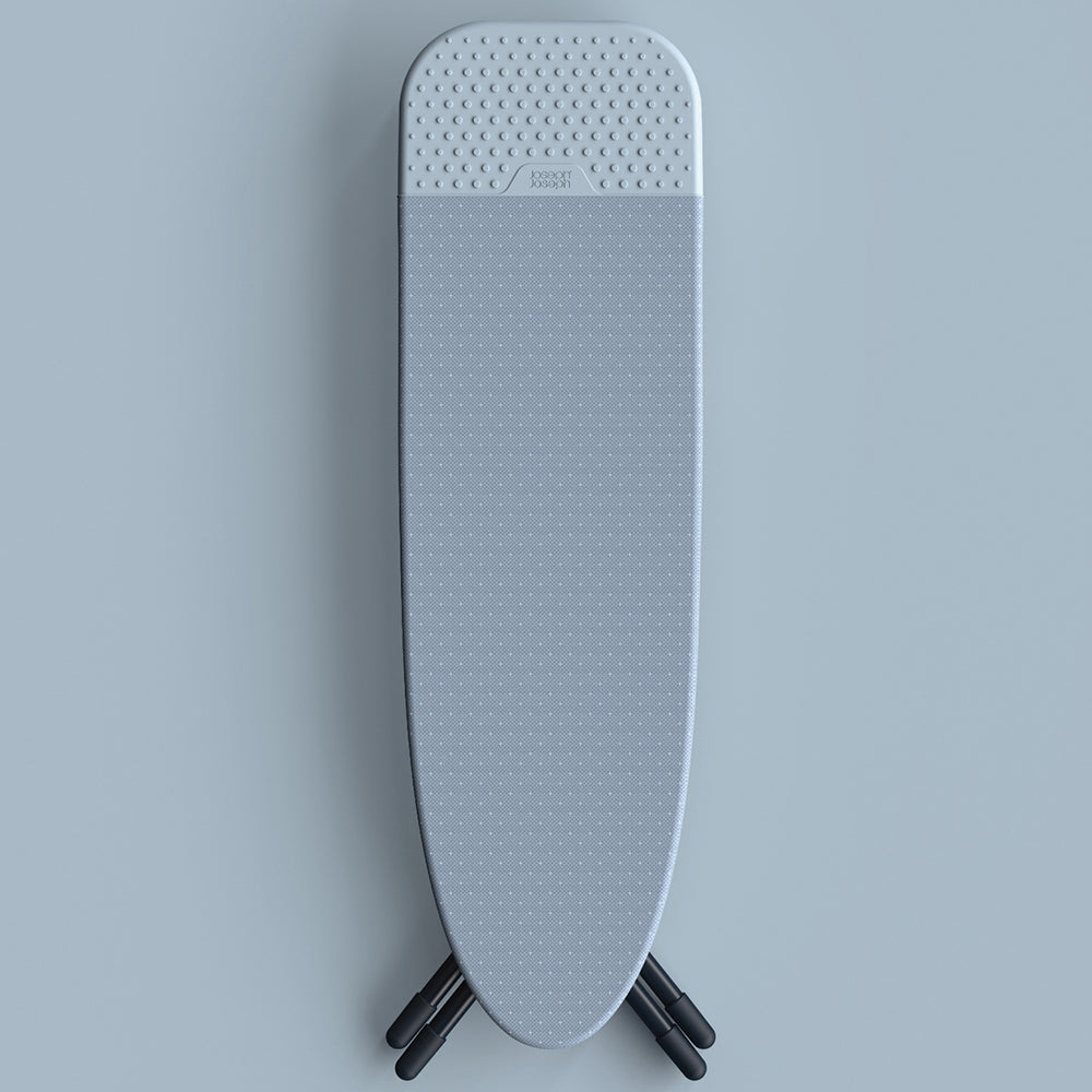 UAE laundry room-Gray ironing board with textured surface on a light gray background