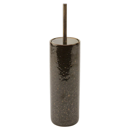 Dark speckled cylindrical container with a metallic straw on a white background