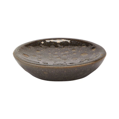 Black ceramic bowl with textured surface on a white background