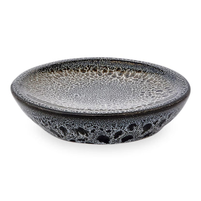Ceramic bowl with textured black and gray design on a white background