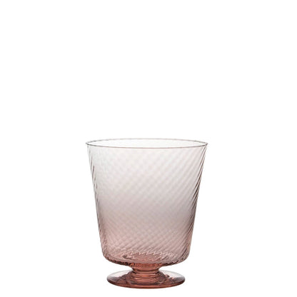 Glass with textured design on a white background
