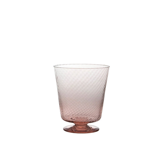 Glass with textured design on a white background