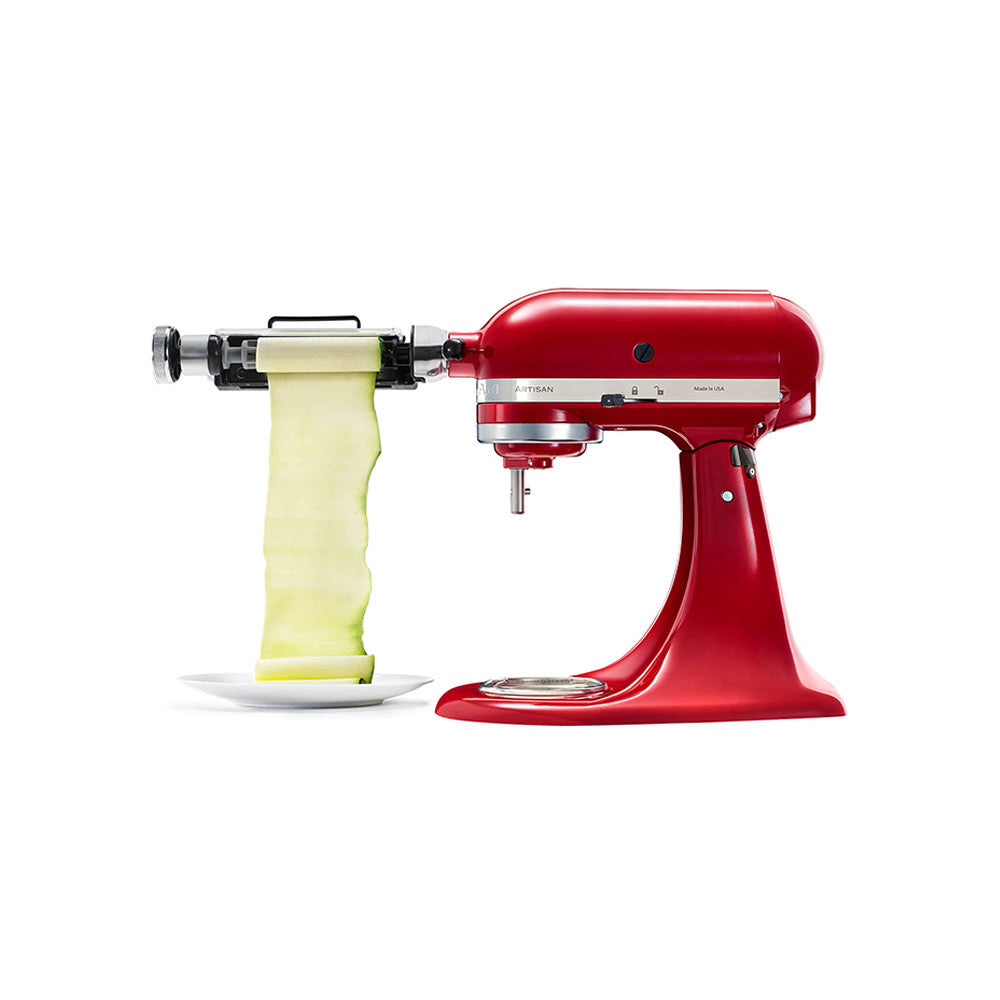 Vegetable Sheet Cutter-Red kitchen appliance with a yellow food item on a white background