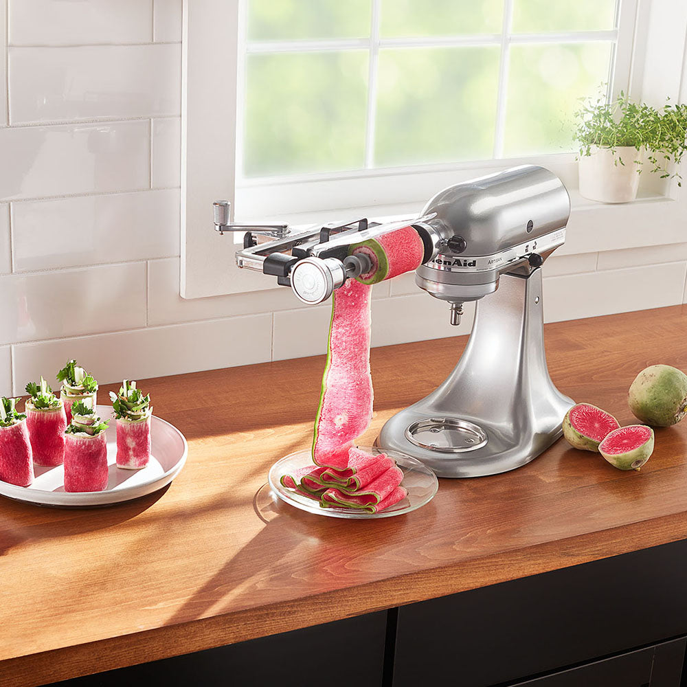 Vegetable Sheet Cutter-Kitchen stand mixer with watermelon skewer attachment on a kitchen counter.