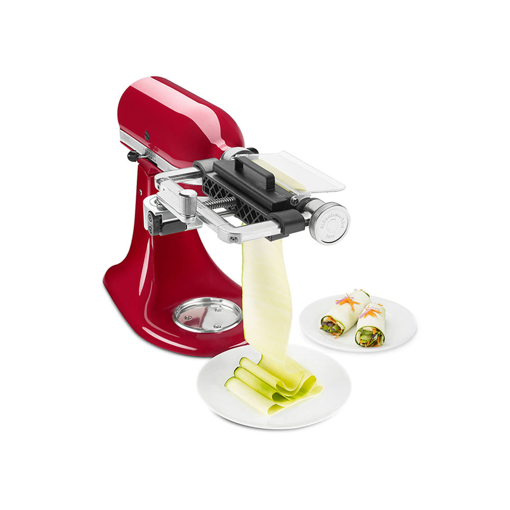 Vegetable Sheet Cutter-Red kitchen appliance with a spiralizer attachment, slicing vegetables on a white background.