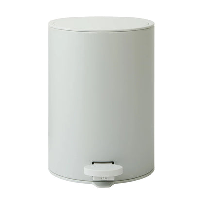 White cylindrical trash bin with a foot pedal on a white background