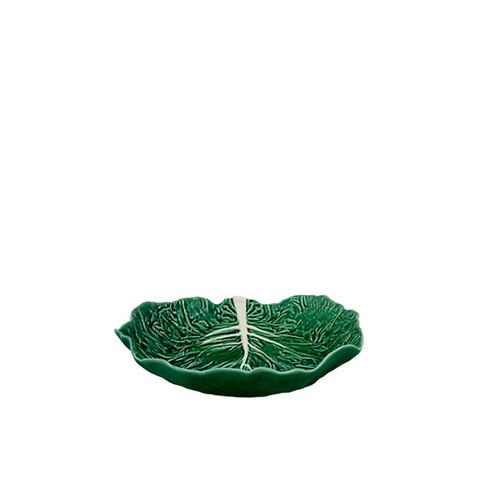 Green ceramic leaf-shaped dish on a white background