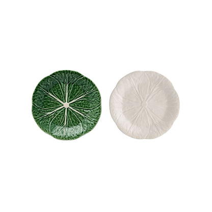 Two round ceramic coasters, one green and one white, on a white background.