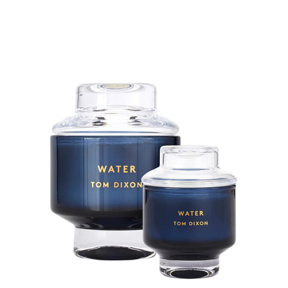 candle-Two blue containers with clear lids labeled 'Water Tom Dixon' on a white background