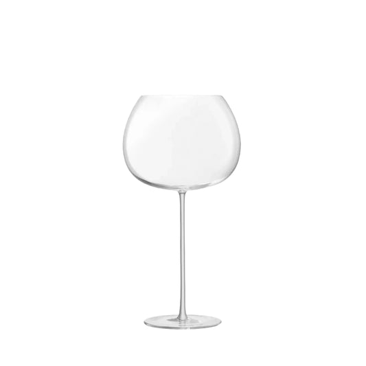 cognac glass-A single clear balloon glass with a wide bowl and a long stem, with no visible contents.