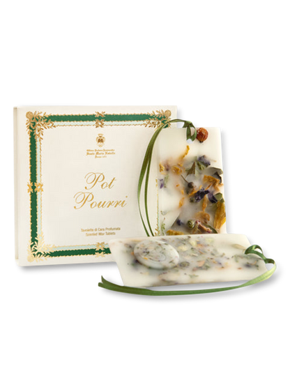 A package of Pot Pourri scented wax tablets, featuring a mix of natural and floral elements, presented in a clear container with green decorative accents and a gold label.