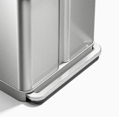 Close-up of a metallic trash can with a white background