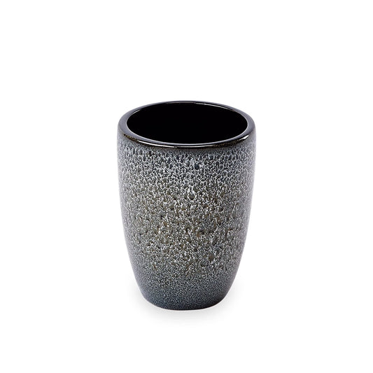 Black textured ceramic cup on a white background