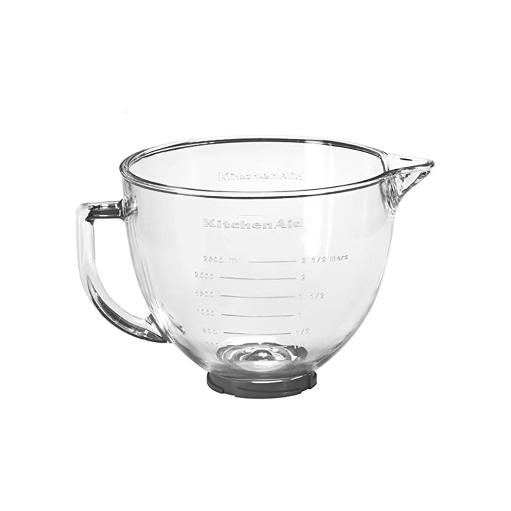 Clear glass mixing bowl with measurement markings on a white background