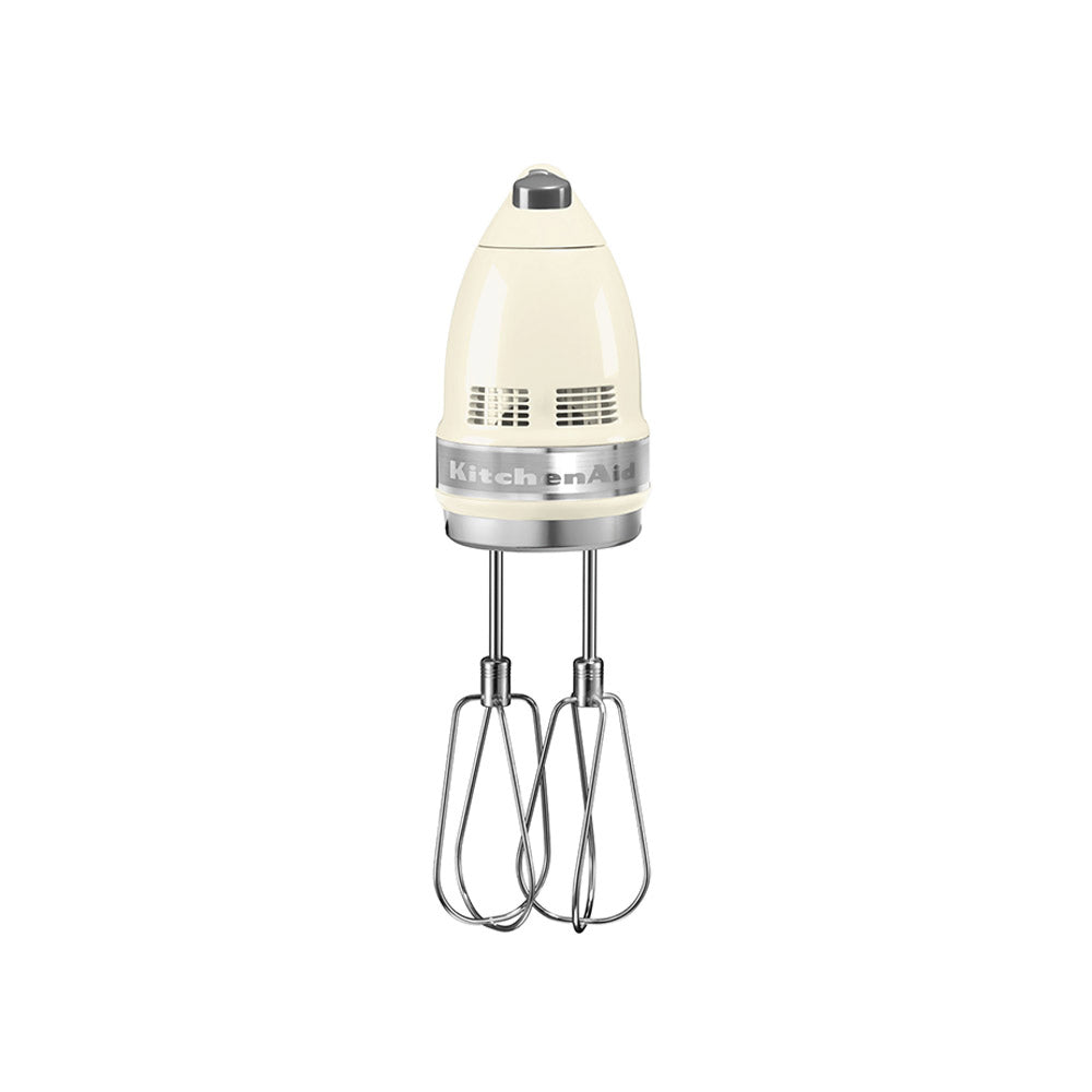 KitchenAid hand mixer with beige attachment on a white background