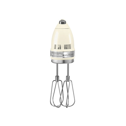 KitchenAid hand mixer with beige attachment on a white background