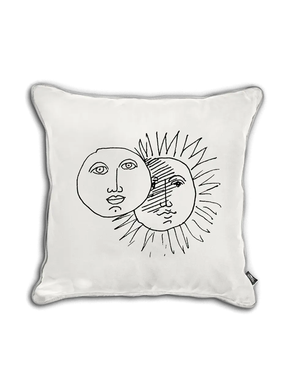 A square-shaped cushion with a white cover, featuring a minimalist design of a sun and moon drawing in black.
