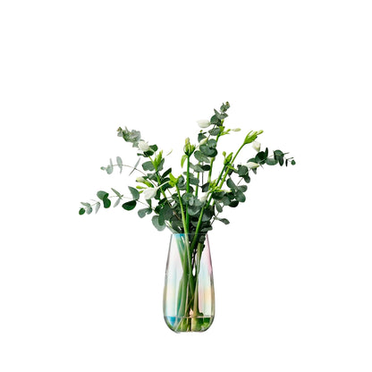 A handcrafted glass vase with a teardrop shape and a fluted texture at the base, featuring a pearlescent lustre finish.