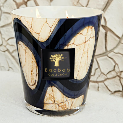 scented candles-Decorative candle with marble-like design and Baobab Collection logo.