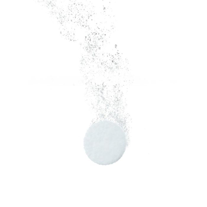 Bubbling clear liquid with a small droplet on a white background