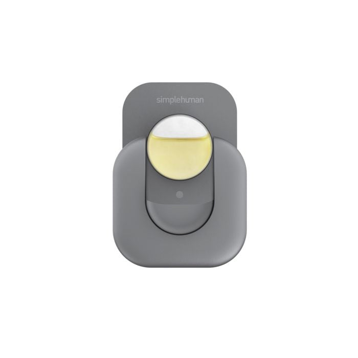 Gray motion sensor with a yellow light on a white background