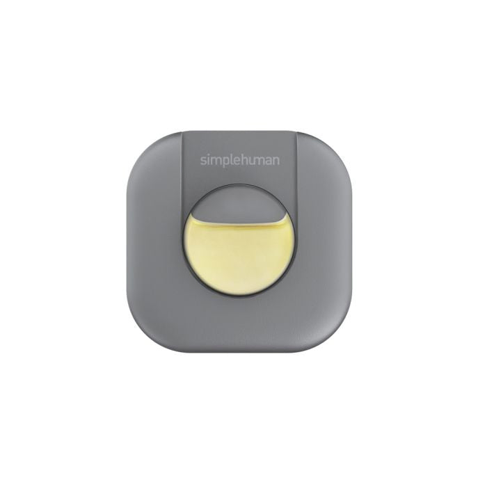 Gray and yellow device with 'simplehuman' branding on a white background