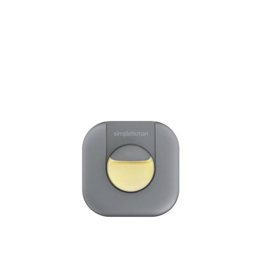 Gray and yellow device with 'simplehuman' branding on a white background